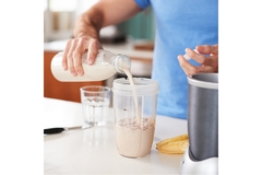 Image Man making protein shake after workout.